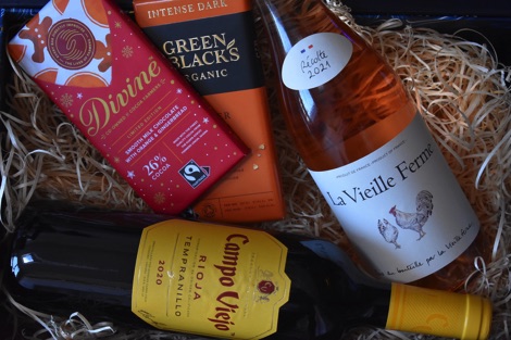 Wine and chocolate in a straw-filed box